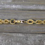 Armband als Kordelkette hohl in Gelbgold 375 / 9 Karat, 18.5 cm lang, 3.3 mm breit, Gewicht ca. 1,8 g.