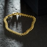 Armband als Panzerkette flach in Gelbgold 333 / 8K, 19 cm lang, 4.7 mm breit, Gewicht ca. 9.8 g.