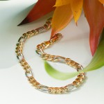 Armband als Figarokette hohl Bicolor in Gelbgold / Weißgold 585 / 14K, 21 cm lang, 5,7 mm breit, Gewicht ca. 5.6 g.