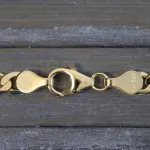 Armband als Panzerkette facettiert in Gelbgold 585 / 14K, 21 cm lang, 5 mm breit, Gewicht ca. 6.8 g.