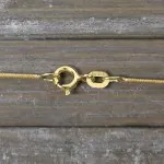 Goldkette als Schlangenkette in Gelbgold 585 / 14K, 60 cm lang, 0,9 mm breit, Gewicht ca. 4.7 g.