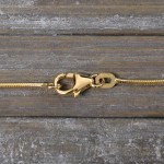 Goldkette als Schlangenkette in Gelbgold 585 / 14K, 42 cm lang, 1,1 mm breit, Gewicht ca. 4.7 g.