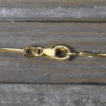 Goldkette als Schlangenkette diamantiert in Gelbgold 585 / 14K, 65 cm lang, 1 mm breit, Gewicht ca. 7.5 g.