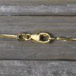 Goldkette als Schlangenkette diamantiert in Gelbgold 585 / 14K, 75 cm lang, 1 mm breit, Gewicht ca. 8.7 g.