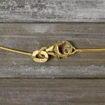 Goldkette als Tondakette in Gelbgold 585 / 14K, 34 cm lang, 0,8 mm breit, Gewicht ca. 2.4 g.
