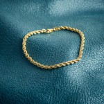 Armband als Kordelkette hohl in Gelbgold 375 / 9K, 20 cm lang, 3.3 mm breit, Gewicht ca. 1.9 g.