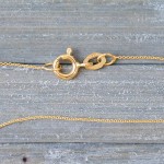 Goldkette als Ankerkette rund in Gelbgold 750 / 18K, 70 cm lang, 0,8 mm breit, Gewicht ca. 1.9 g.