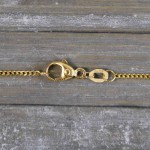 Goldkette als Panzerkette flach in Gelbgold 750 / 18K, 80 cm lang, 1,2 mm breit, Gewicht ca. 5.5 g.