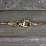 Goldkette als Schlangenkette in Gelbgold 750 / 18 Karat, 90 cm lang, 1.2 mm breit, Gewicht ca. 9.3 g.