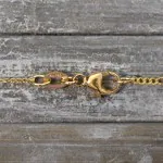 Goldkette als Figarokette diamantiert in Gelbgold 750 / 18 Karat, 65 cm lang, 1.5 mm breit, Gewicht ca. 3.7 g.