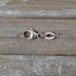 Goldkette als Panzerkette flach in Weißgold 750 / 18K, 60 cm lang, 1,1 mm breit, Gewicht ca. 3.2 g.