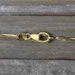 Goldkette als Schlangenkette diamantiert in Gelbgold 585 / 14K, 75 cm lang, 1 mm breit, Gewicht ca. 8.7 g.