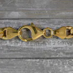 Goldkette als Figarokette hohl Bicolor in Gelbgold / Weißgold 333 / 8K, 50 cm lang, 5,7 mm breit, Gewicht ca. 9.1 g.