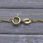 Goldkette als Singapurkette in Gelbgold 375 / 9 Karat, 100 cm lang, 1.4 mm breit, Gewicht ca. 3.6 g.