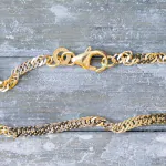 Armband als Singapurkette Bicolor in Gelbgold / Weißgold 333 / 8K, 21 cm lang, 2,4 mm breit, Gewicht ca. 1.9 g.