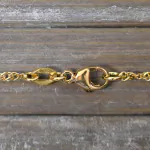 Goldkette als Singapurkette in Gelbgold 750 / 18K, 45 cm lang, 1.8 mm breit, Gewicht ca. 3.5 g.